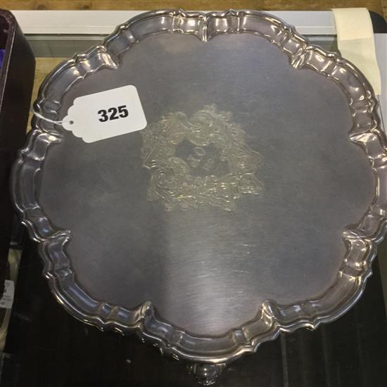 Circular silver salver with piecrust edge, three scrolled feet & engraved cartouche, Sheffield 1903